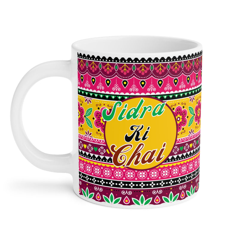 Personalized Sidra Ki Chai mug with hot tea steam and cookies