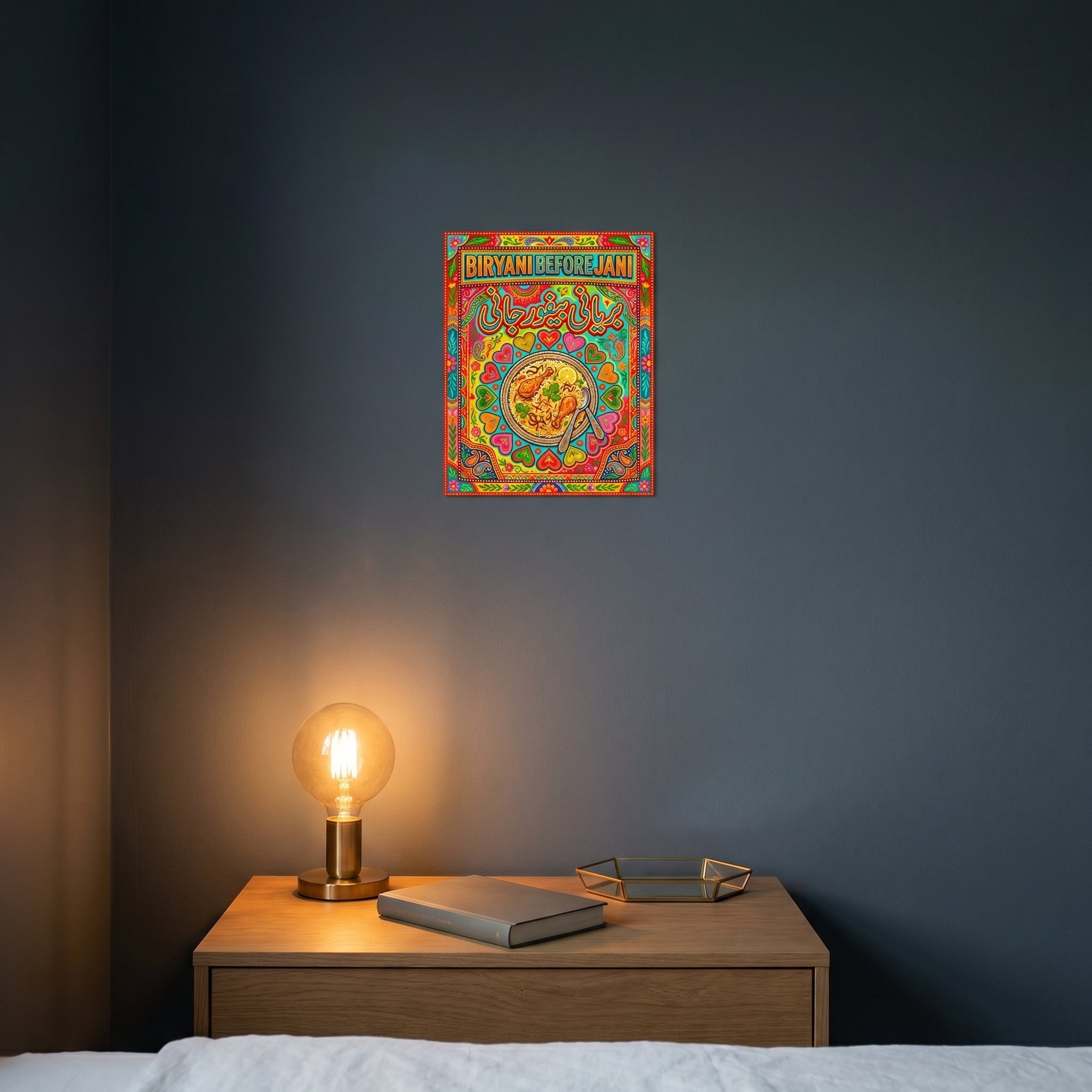 Colorful Desi heritage room decor poster hanging under warm ambient lighting above a dark wooden bedroom nightstand.