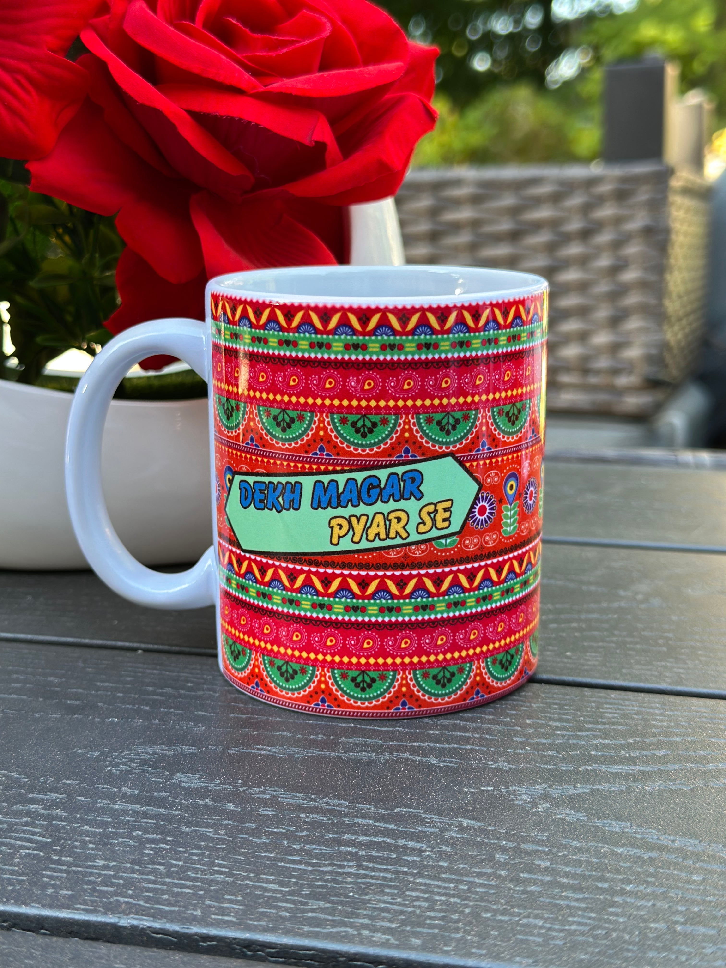 “Dekh Magar Pyar Se ceramic coffee mug with colorful truck art design”

“11oz ceramic cultural mug for coffee and tea lovers”

“Funny desi truck art coffee cup gift”

“Colorful ceramic mug with quirky message”

“Unique 11oz mug inspired by South Asian truck art”