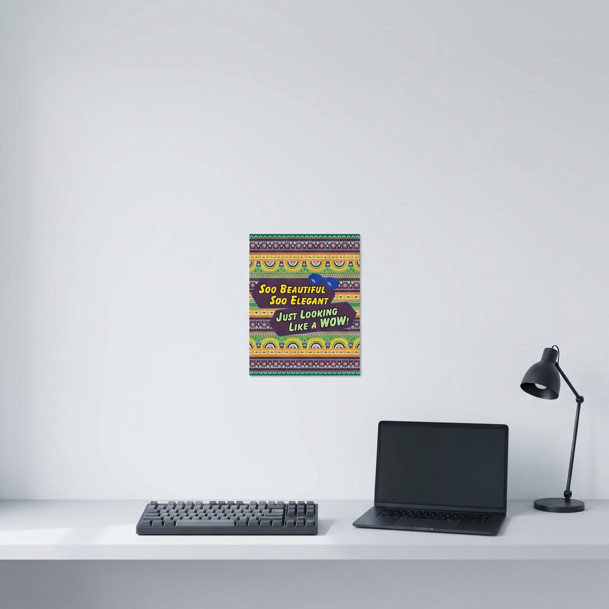 Funny Desi viral meme slogan wall art hanging neatly on a clean white wall behind a minimalist home office computer workspace
