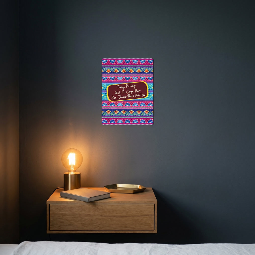 Modern bedroom nightstand setup featuring the colorful Punjabi truck art poster catching warm ambient light from a lamp.
