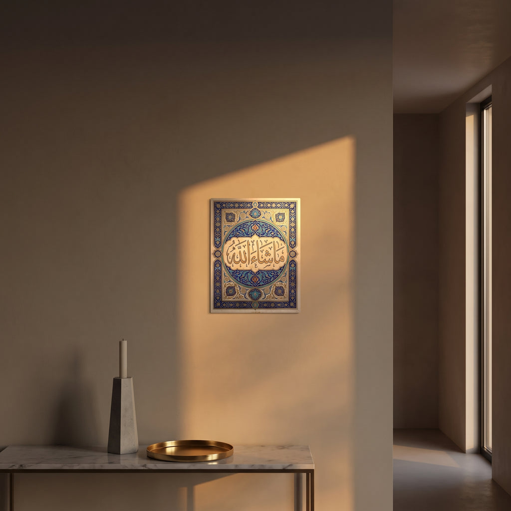 Ornate blue and gold Islamic illuminated border metal print catching warm afternoon window sunlight on a textured plaster wall above a table.
