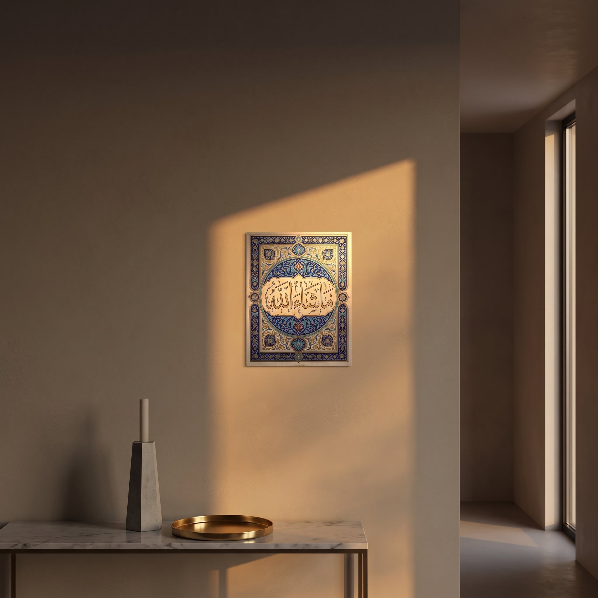 Ornate blue and gold Islamic illuminated border metal print catching warm afternoon window sunlight on a textured plaster wall above a table.
