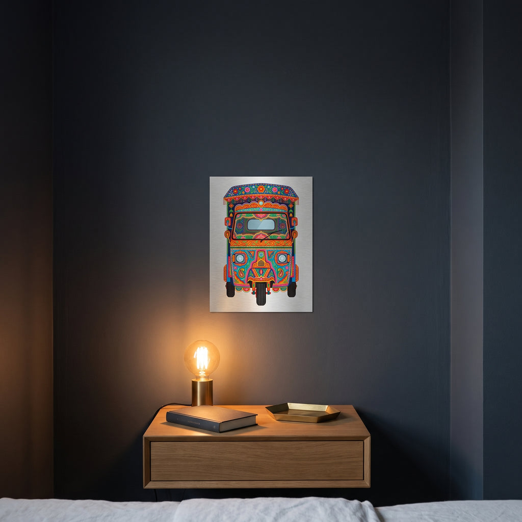 Pakistani blue auto-rickshaw art metal poster styled on a contemporary bedroom nightstand catching warm ambient light from a lamp.