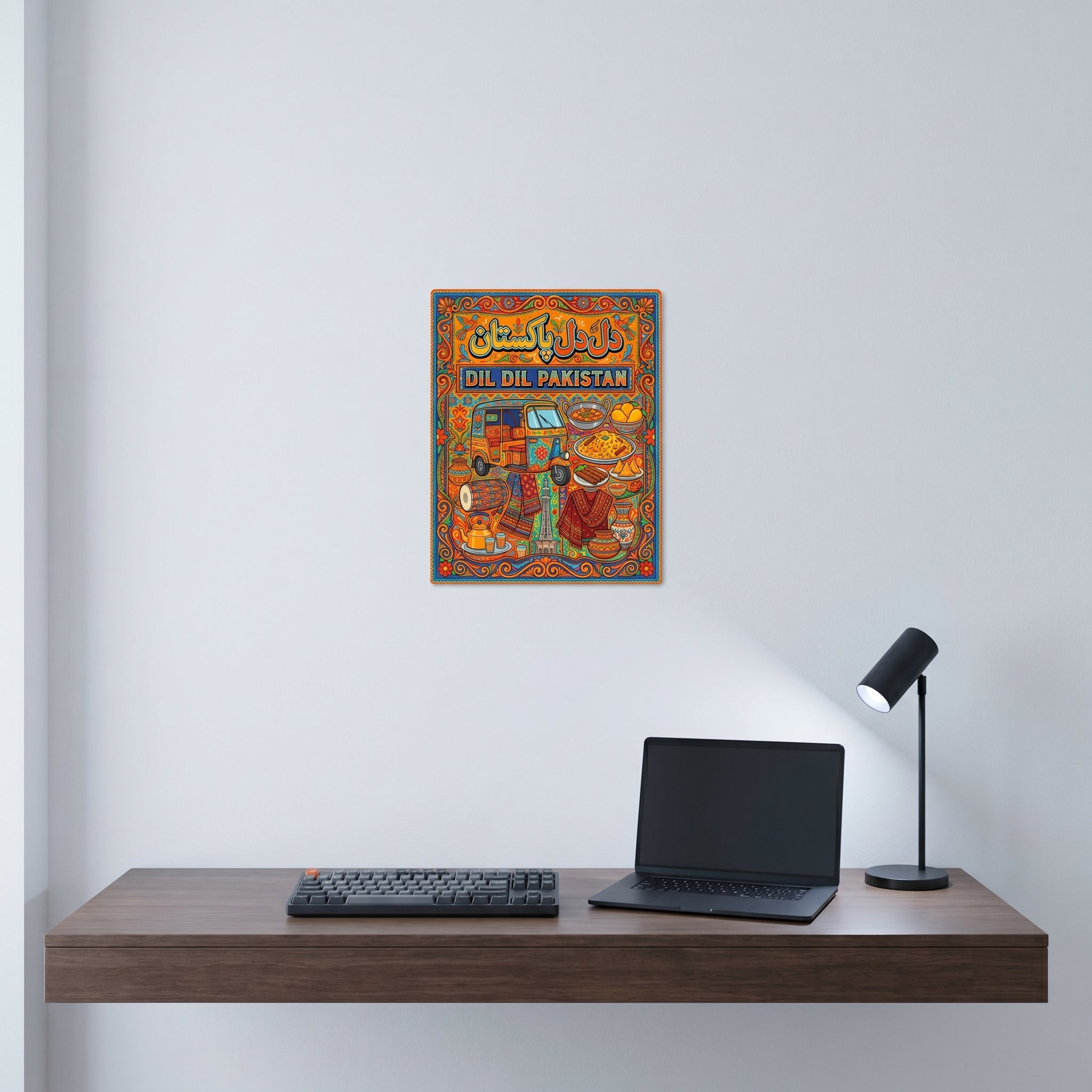 "Patriotic Pakistani heritage culture wall art print displayed neatly on a white wall behind a modern minimalist computer workspace."
