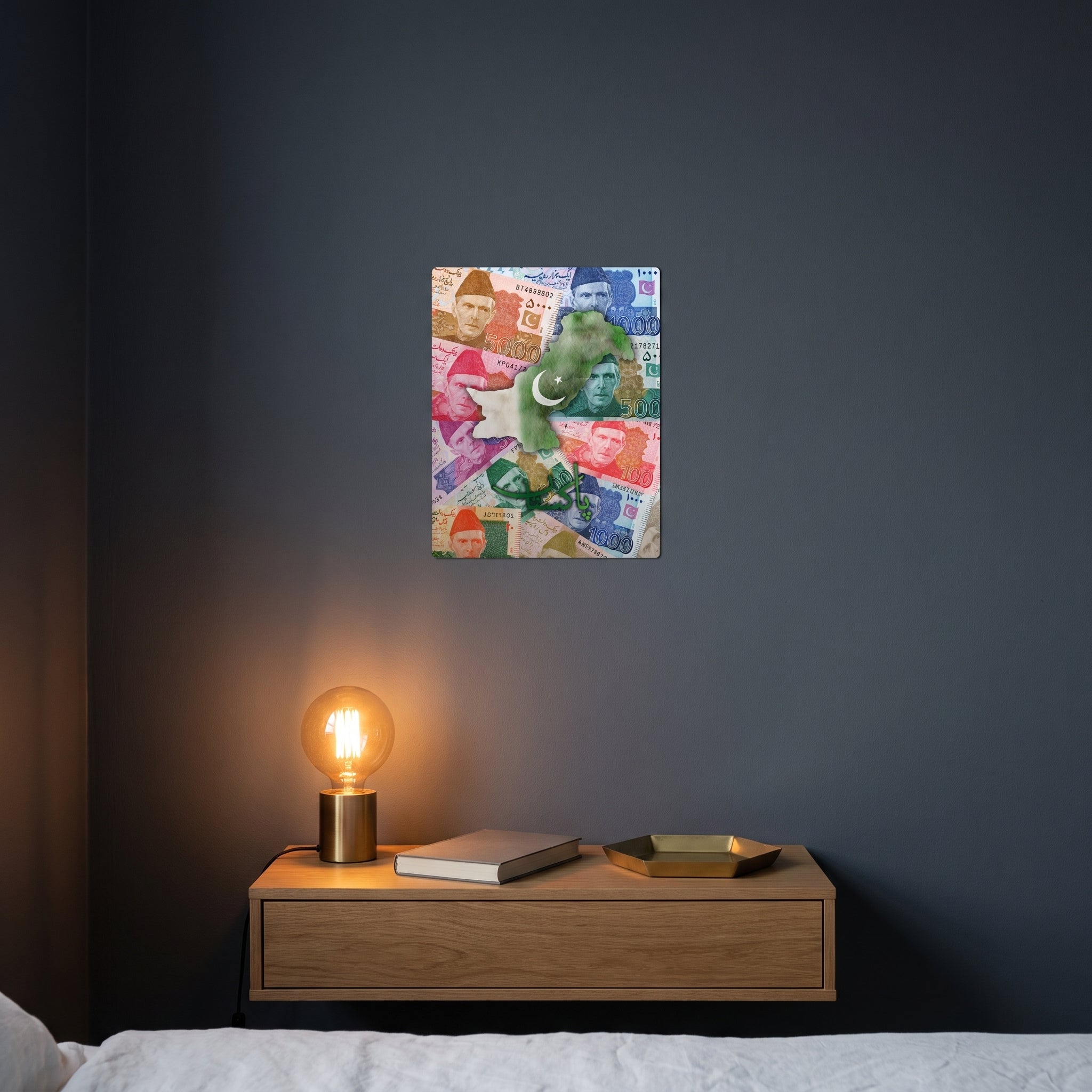 Patriotic Pakistani theme slogan metal panel styled on a contemporary bedroom nightstand catching warm ambient light from a lamp.