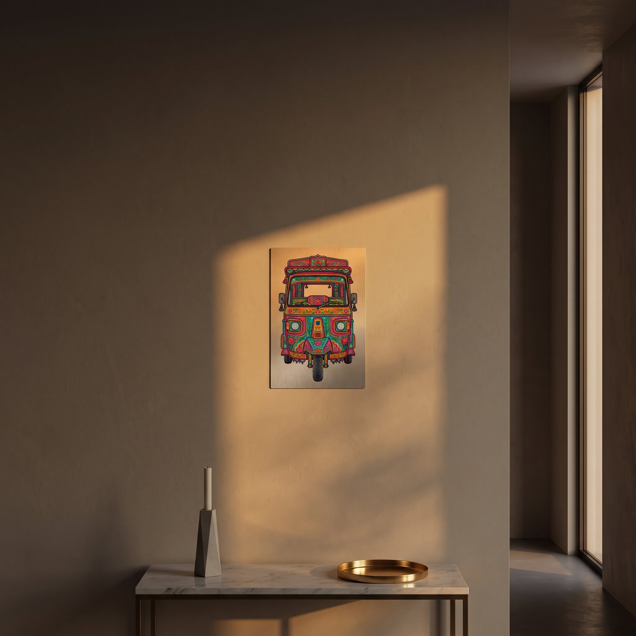 Sleek, vibrant Rickshaw heritage metal print catching warm, golden afternoon sunlight on a textured plaster wall above a table.
