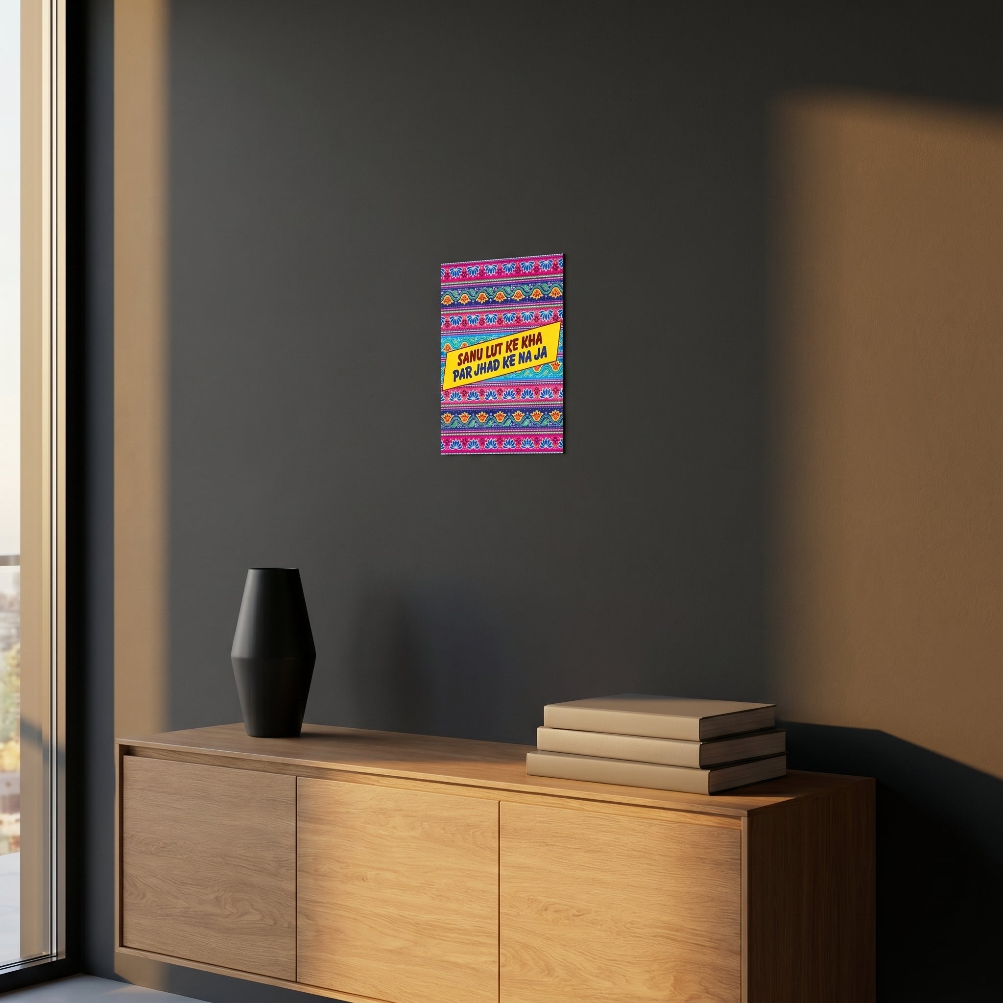 Humorous South Asian diaspora aluminum slogan sign styled on a dark grey accent wall over a modern wooden sideboard cabinet.