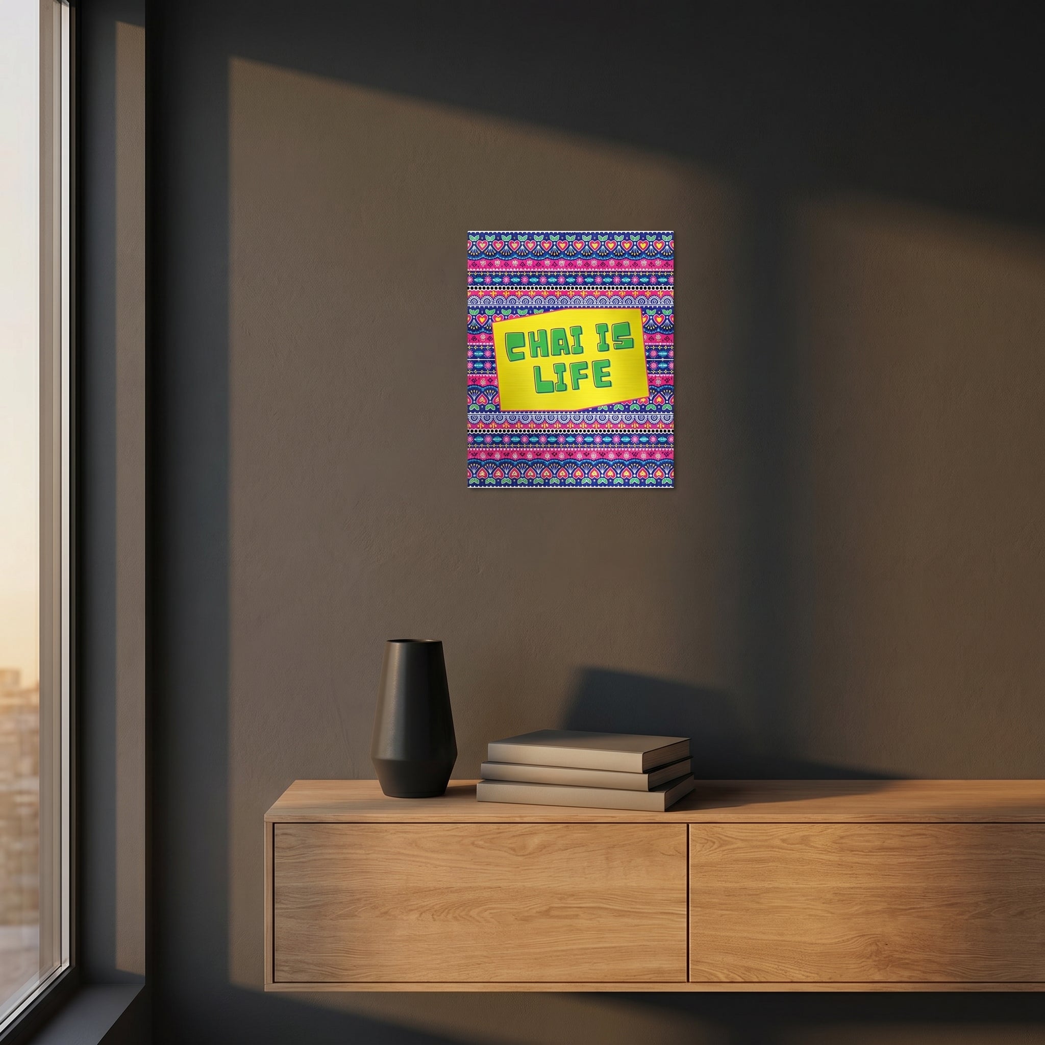 The Chai Is Life artwork styled inside a premium frame in the console table mockup with dramatic golden afternoon window sunlight.
