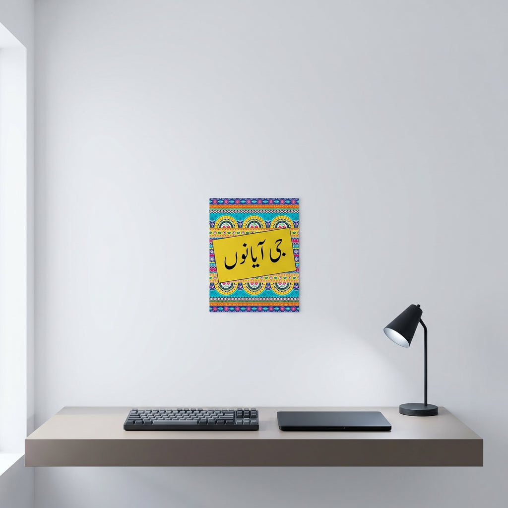 Traditional Punjabi typography greeting wall art print hanging neatly on a white wall above a minimalist home office computer workspace.
