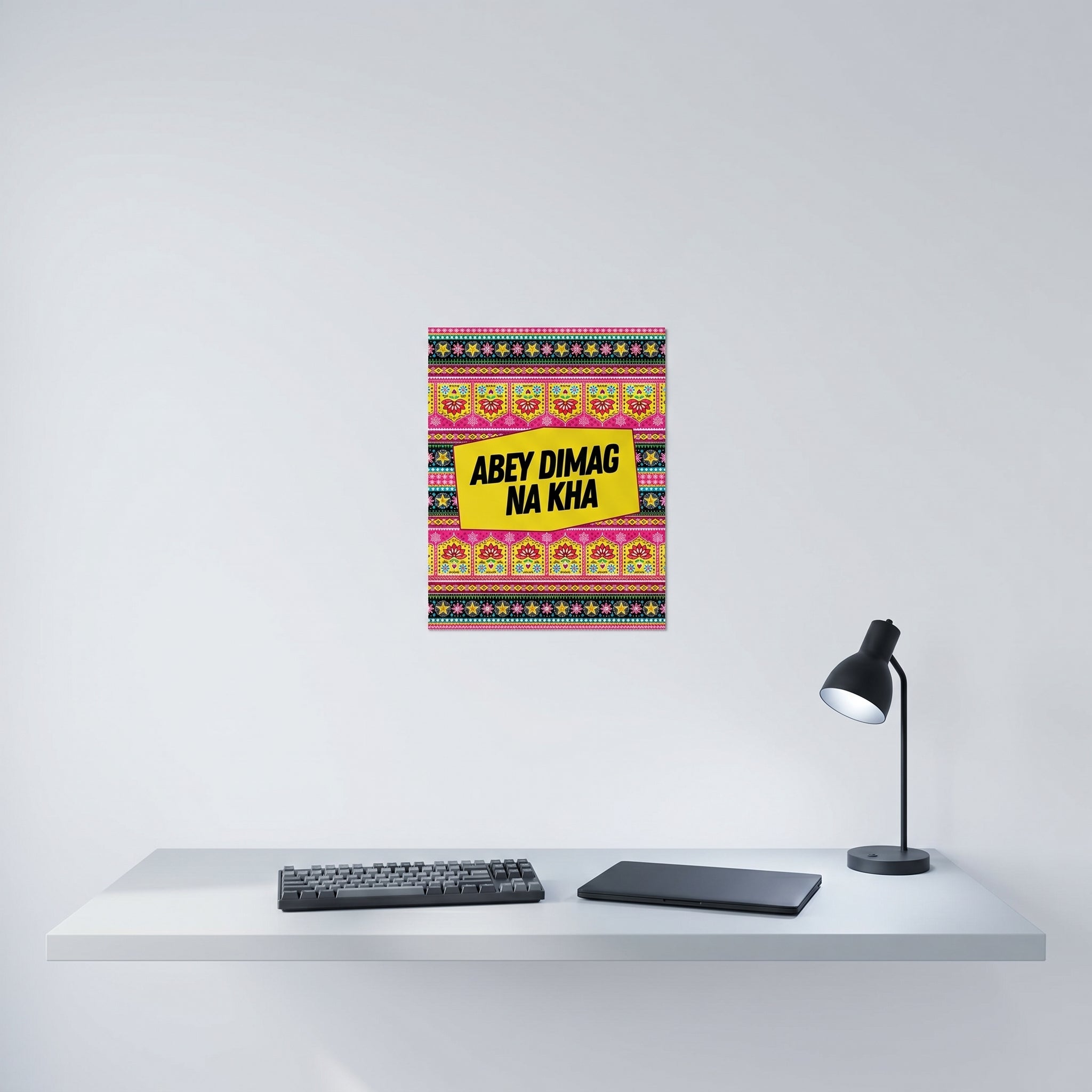 Vibrant Desi culture poster hanging elegantly on a crisp white wall behind a modern minimalist home office desk setup.

