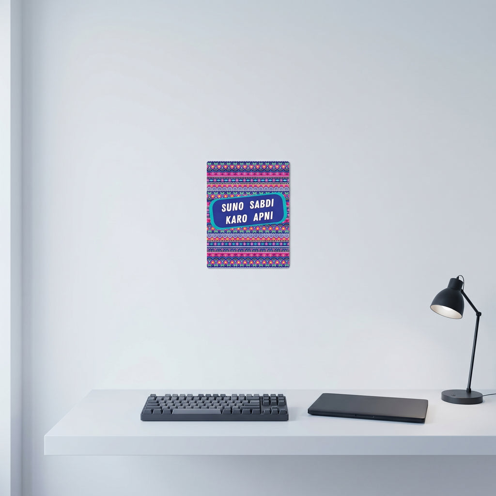 Vibrant Desi slogan art poster hanging gracefully on a crisp white wall behind a clean, minimalist home office desk setup.

