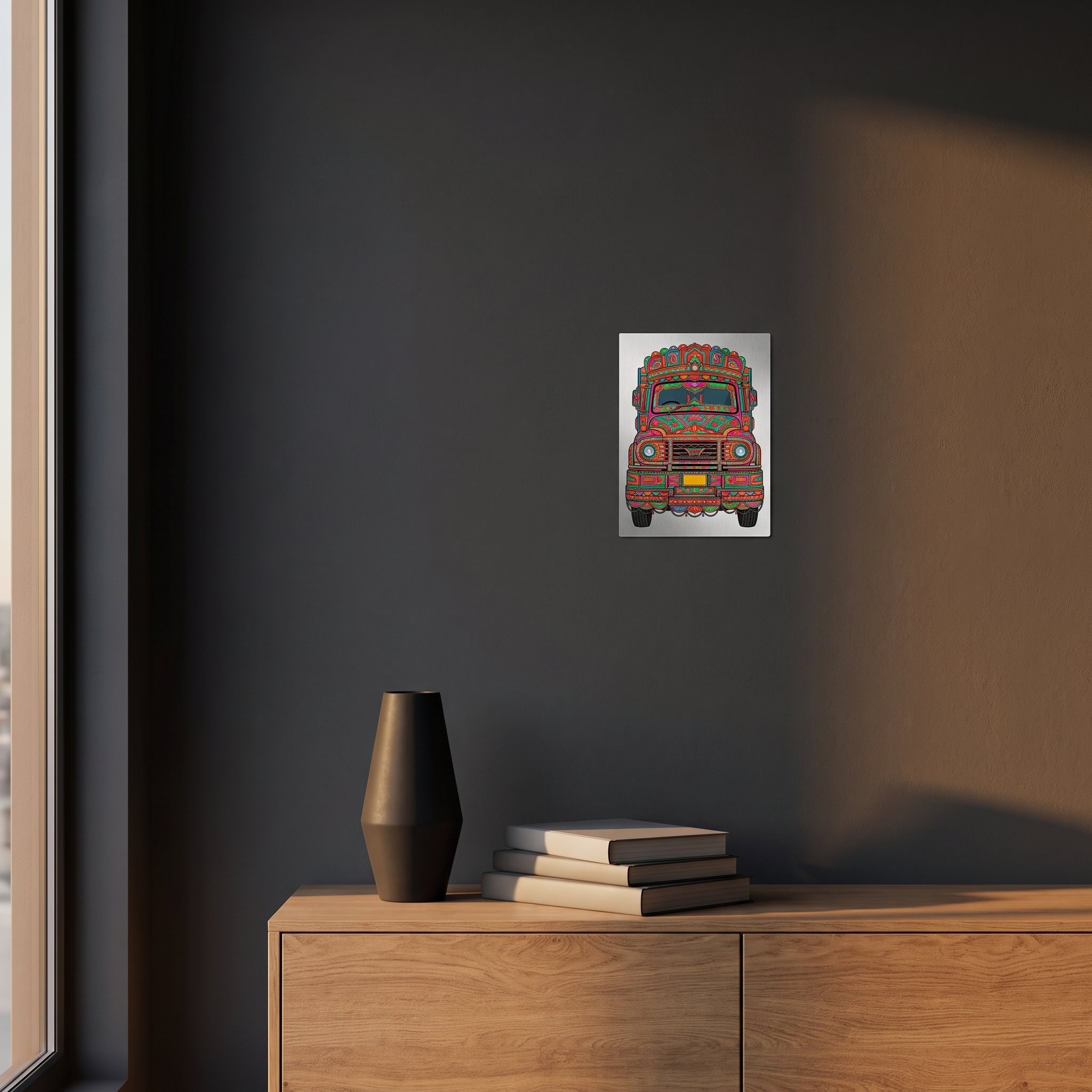 Vibrant Pakistani folk art statement sign styled on a dark charcoal grey accent wall over a modern wooden sideboard cabinet.
