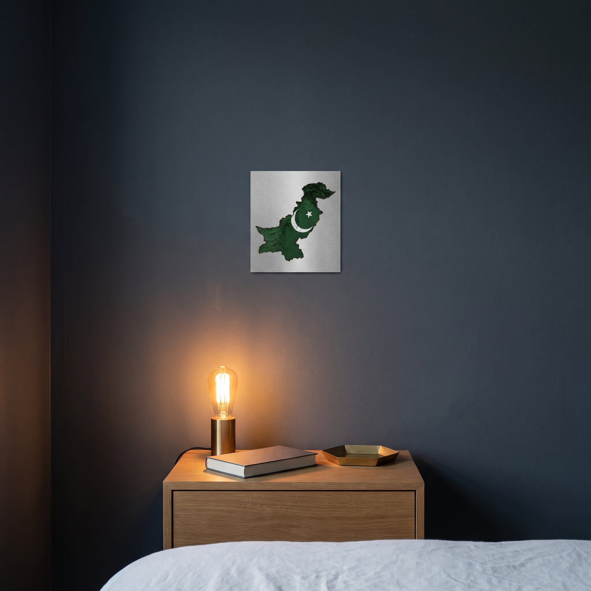 Pakistani green flag map metVibrant Pakistani map statement sign styled on a crisp white wall behind a 