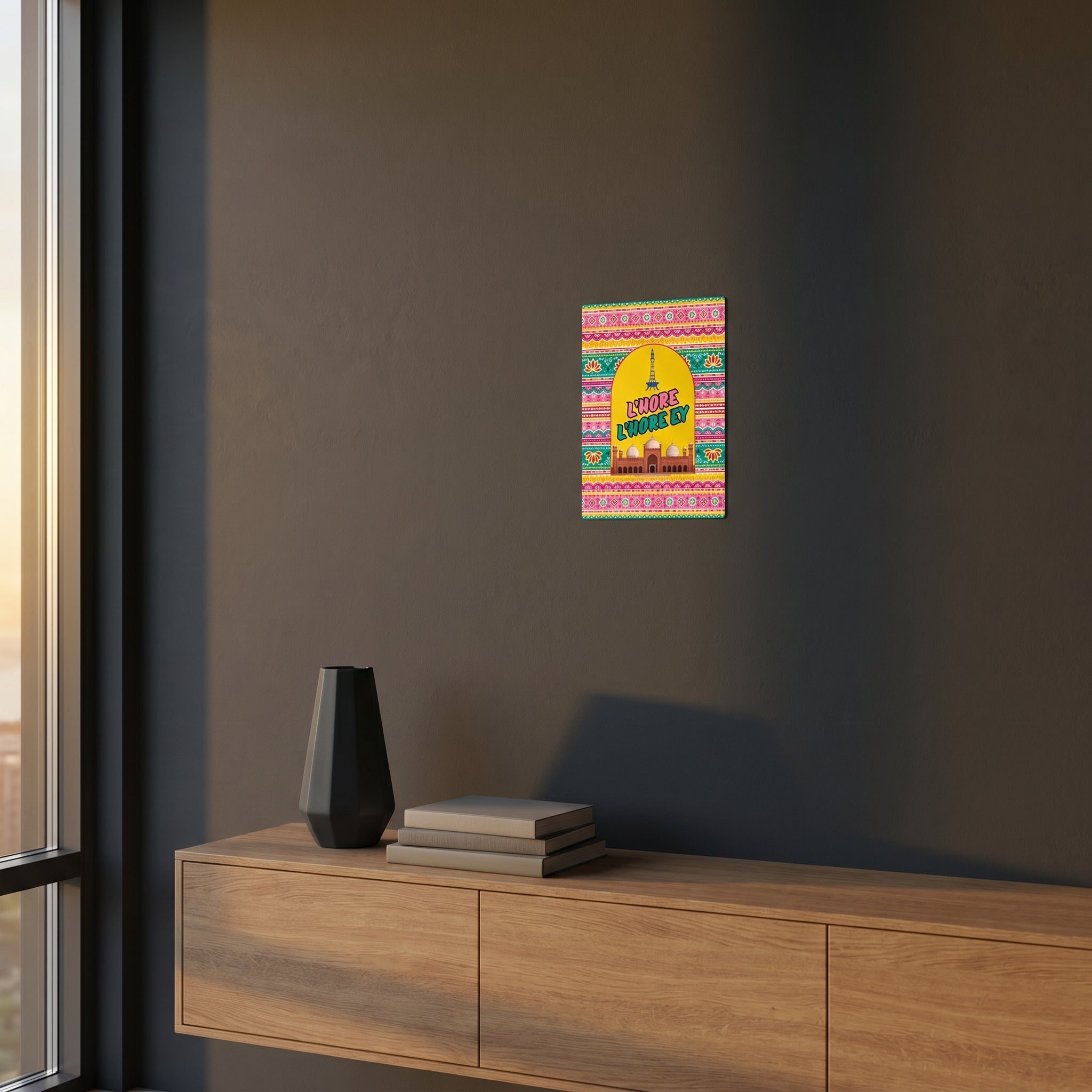 Vibrant South Asian architectural statement sign styled on a dark grey accent wall over a modern wooden sideboard cabinet.