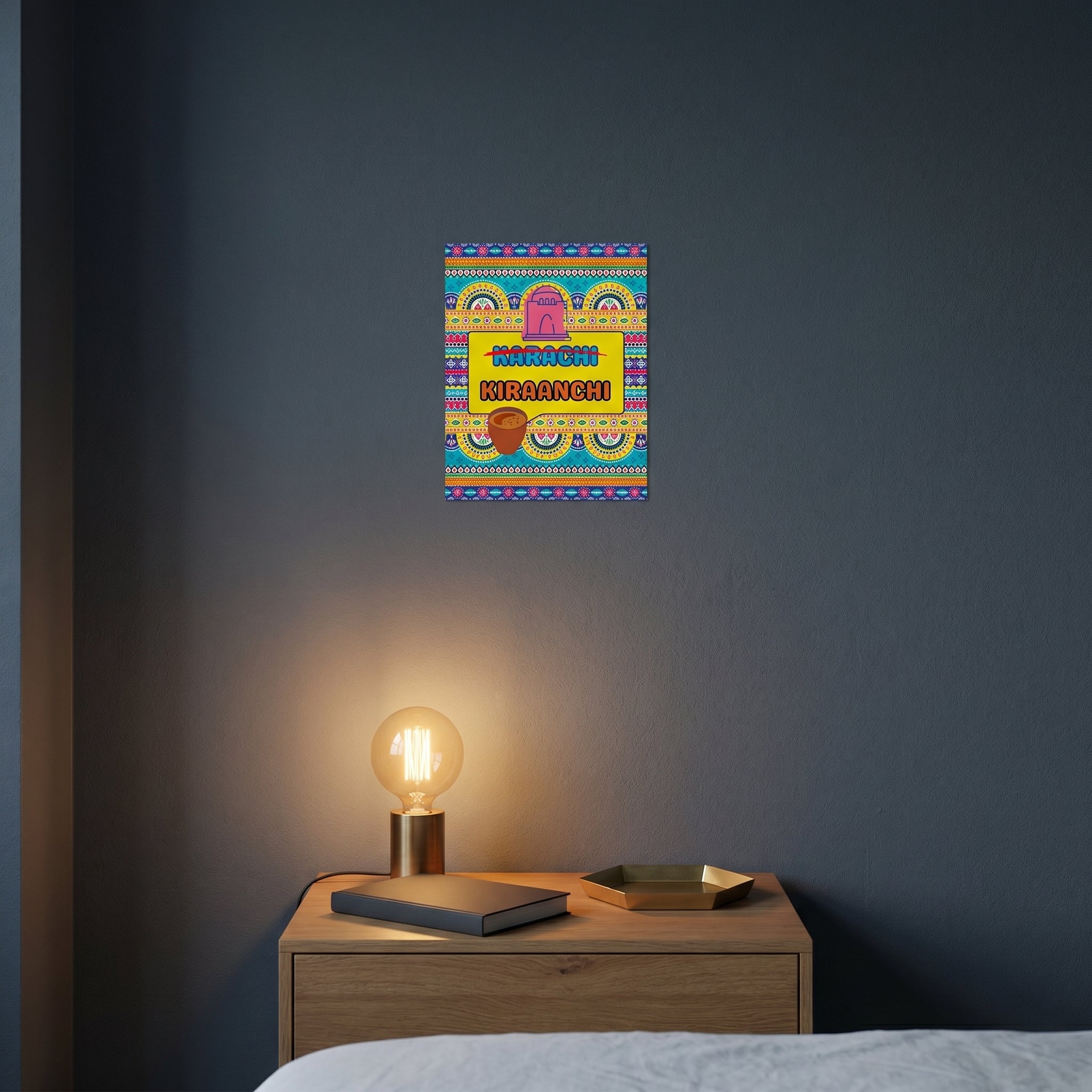 Vibrant South Asian city pride statement sign styled on a dark grey accent wall over a modern wooden sideboard cabinet.