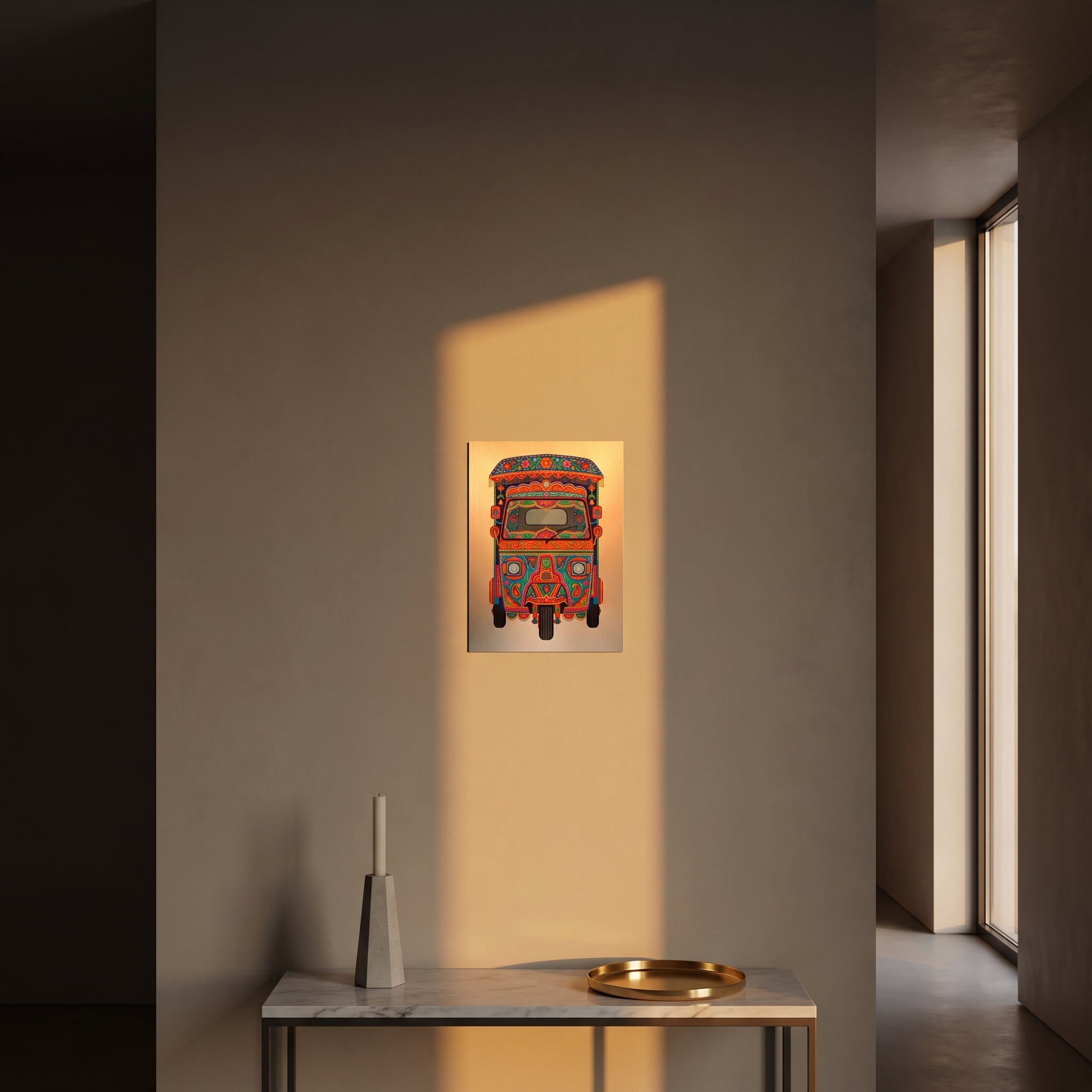 Vibrant Pakistani folk art statement sign styled on a crisp white wall behind a minimalist home office desk setup with a keyboard.